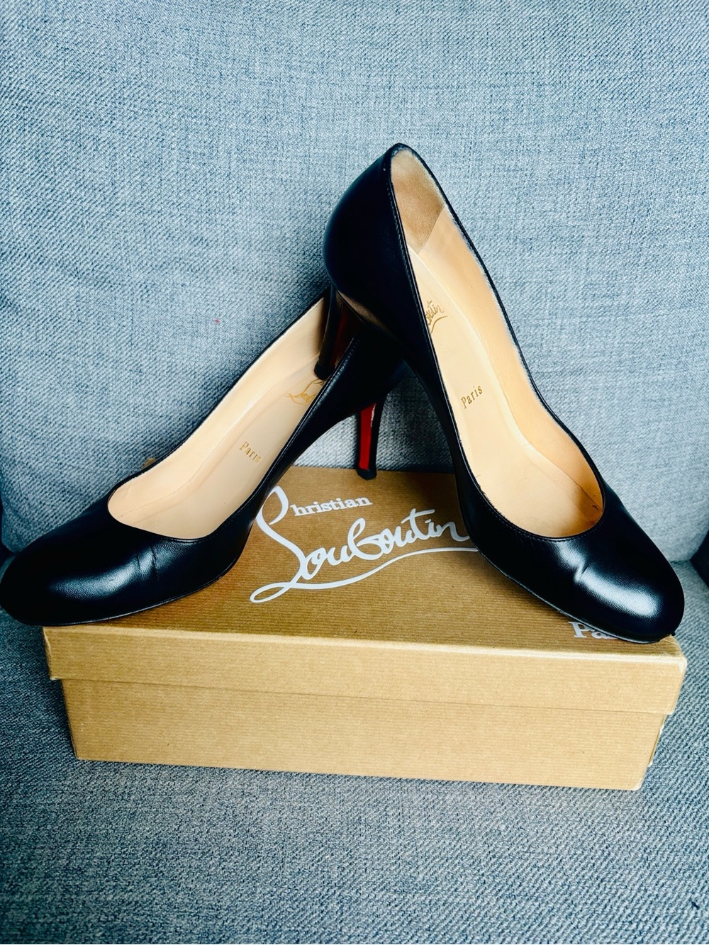 Christian Louboutin Black Leather Round-Toe Stiletto Pumps with Red Sole